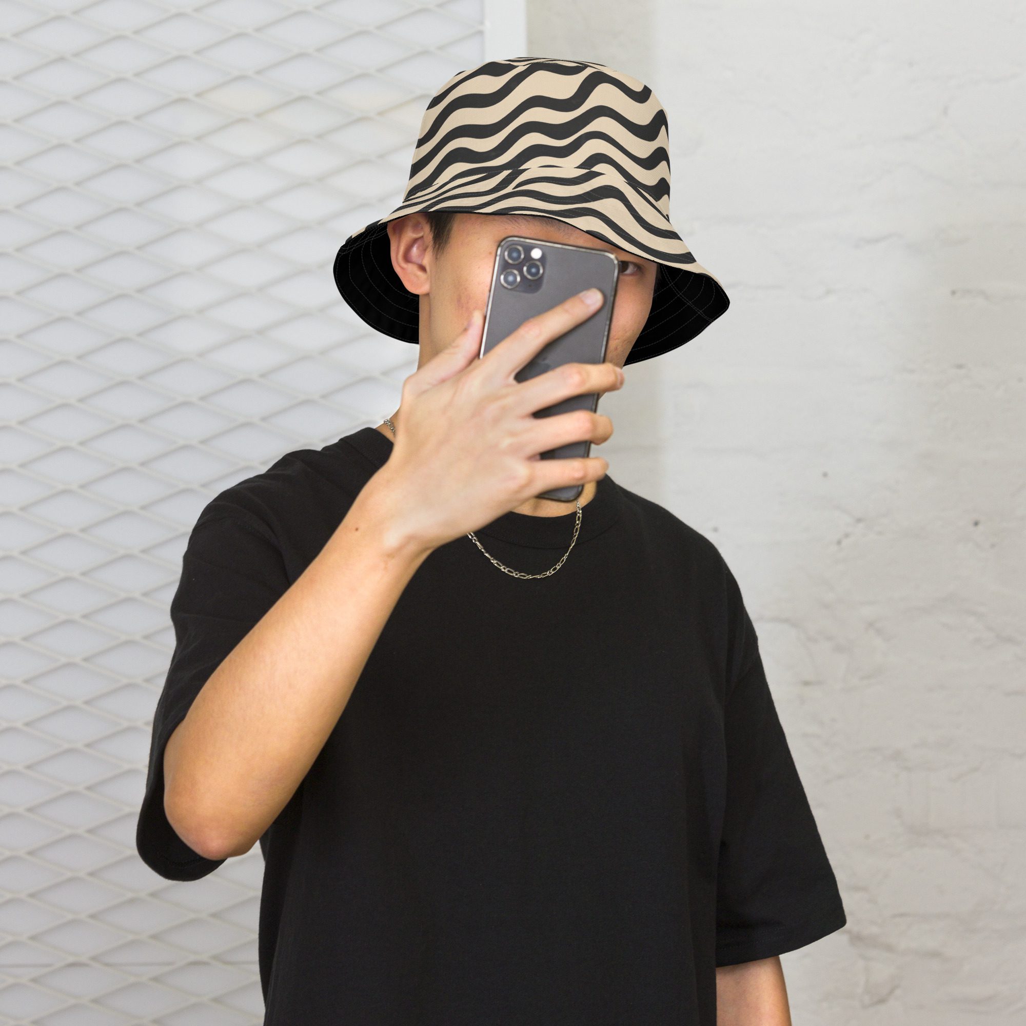 black and white reversible bucket hat with Wavy lines